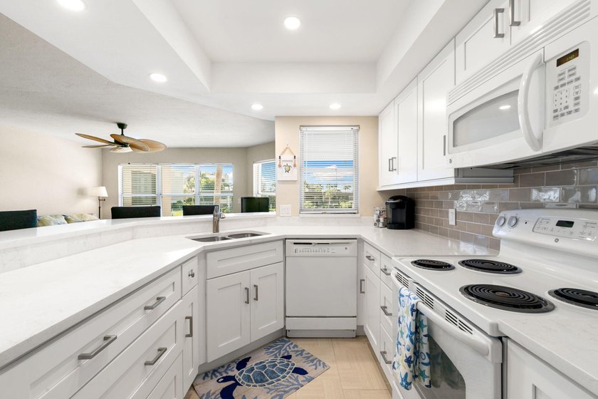 Bask in SPECTACULAR WATERFRONT VIEWS from this 2-bedroom, 2-bath - Beach Condo for sale in Marco Island, Florida on Beachhouse.com