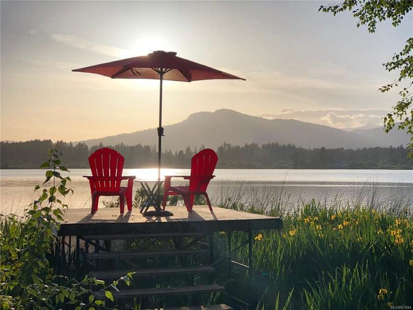 Enjoy a moment of reflection on this lakefront 2.70 acreage. The - Beach Home for sale in Duncan, British Columbia on Beachhouse.com