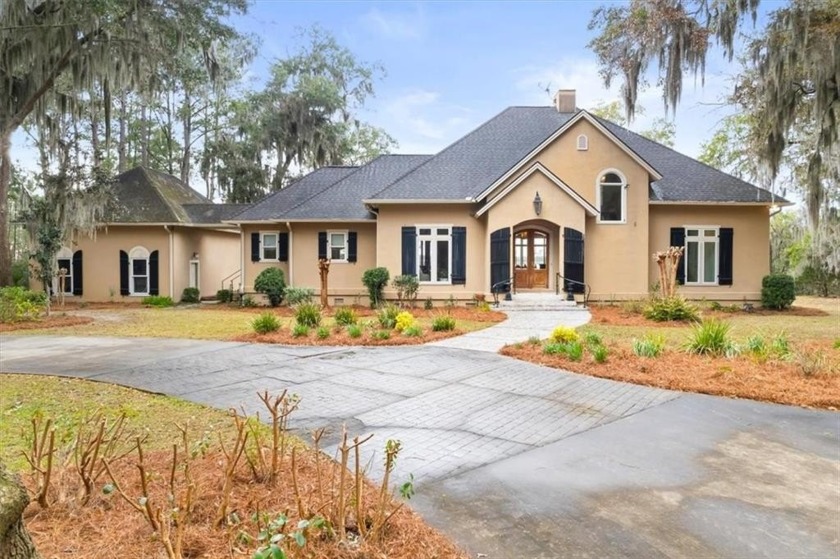 Nestled along the serene banks of the Julienton River, this - Beach Home for sale in Townsend, Georgia on Beachhouse.com