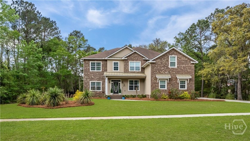 Welcome to this 5-bedroom, 4-bath home that sits on a 1.49-acre - Beach Home for sale in Richmond Hill, Georgia on Beachhouse.com