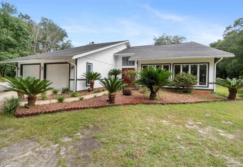 Welcome to this expansive 5-bedroom, 3-bath home, set on 1.32 - Beach Home for sale in Pensacola, Florida on Beachhouse.com