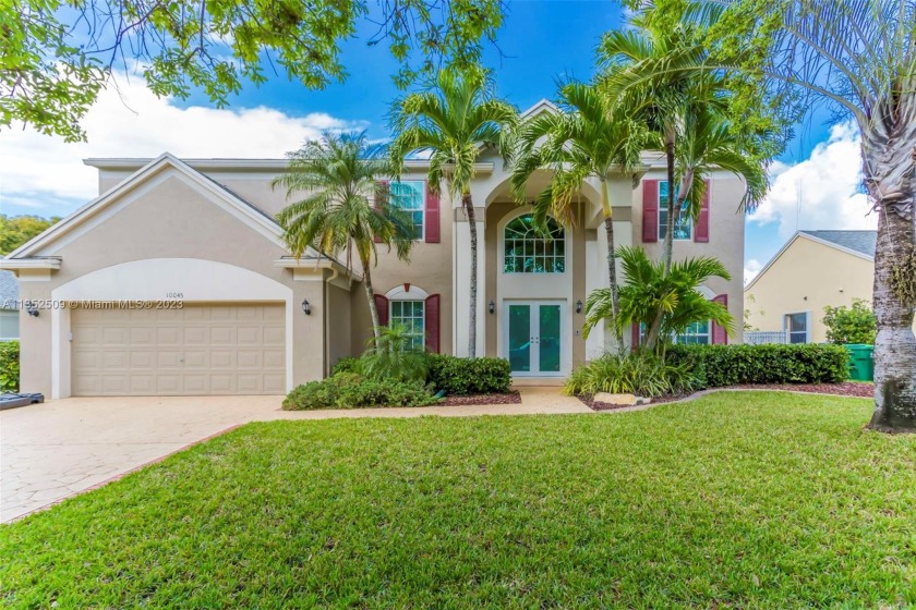 SHOWS LIKE A MODEL! GORGEOUS TWO STORY HOME WITH POOL AND LAKE - Beach Home for sale in Cooper City, Florida on Beachhouse.com