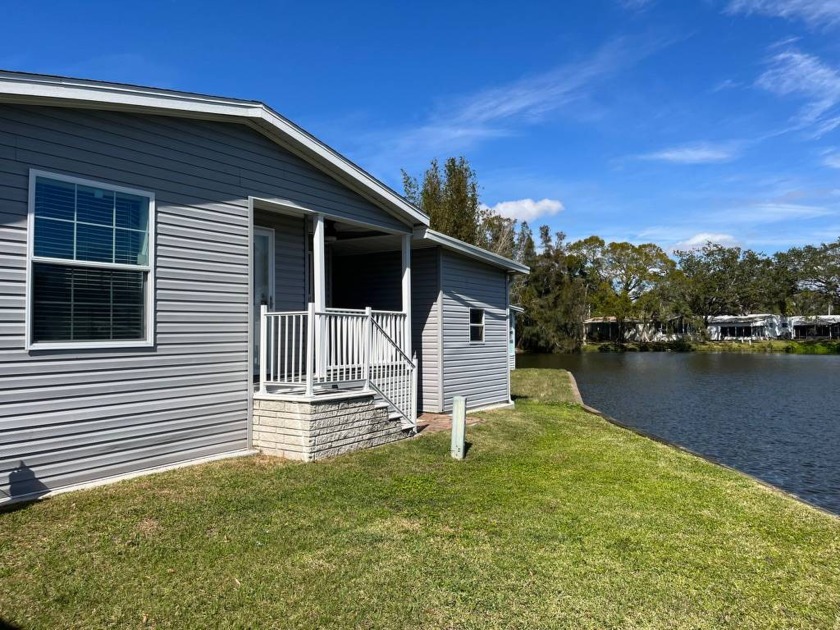 This property is on leased land with a monthly lot rent of $735 - Beach Home for sale in Tampa, Florida on Beachhouse.com
