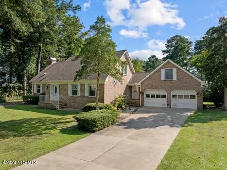 Waterfront in River Bend! This brick Cape Cod style home has - Beach Home for sale in New Bern, North Carolina on Beachhouse.com