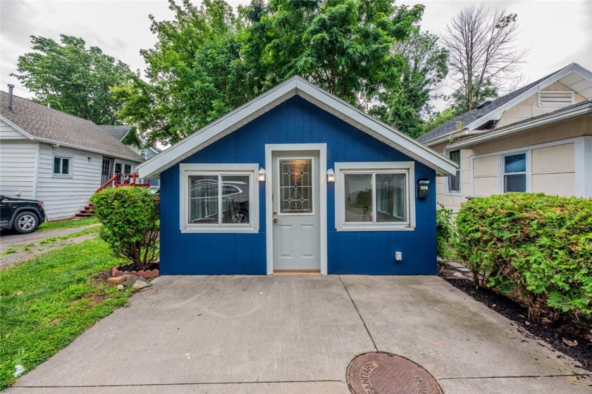 AMAZING location! This charming ranch is nestled in a tranquil - Beach Home for sale in Irondequoit, New York on Beachhouse.com