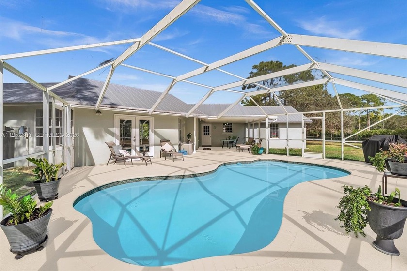 Set within the gated equestrian community of Stuart West, this - Beach Home for sale in Palm City, Florida on Beachhouse.com