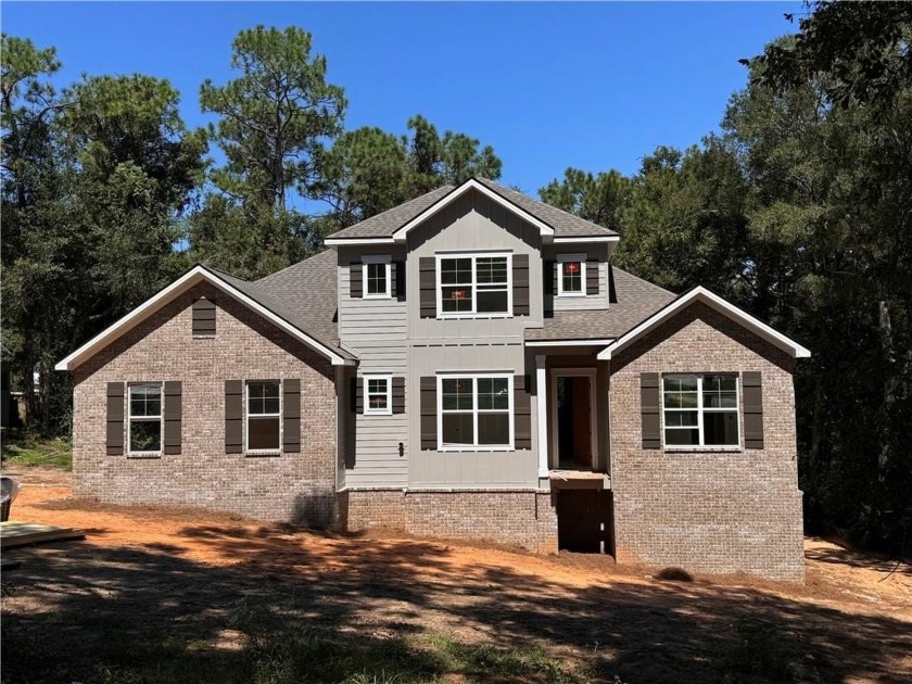 UNDER CONSTRUCTION* Nestled on nearly  3/4  of an acre, this - Beach Home for sale in Fairhope, Alabama on Beachhouse.com