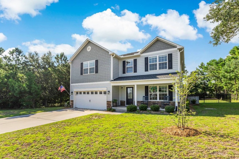 Say hello to the ideal coastal farmhouse designed for - Beach Home for sale in Shallotte, North Carolina on Beachhouse.com