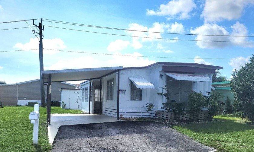 Charming 3-Bedroom, 2-Bath Renovated Mobile Home with Screened - Beach Home for sale in West Palm Beach, Florida on Beachhouse.com