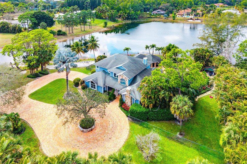 Welcome to a truly rare gated waterfront estate set on 1.56 - Beach Home for sale in West Palm Beach, Florida on Beachhouse.com