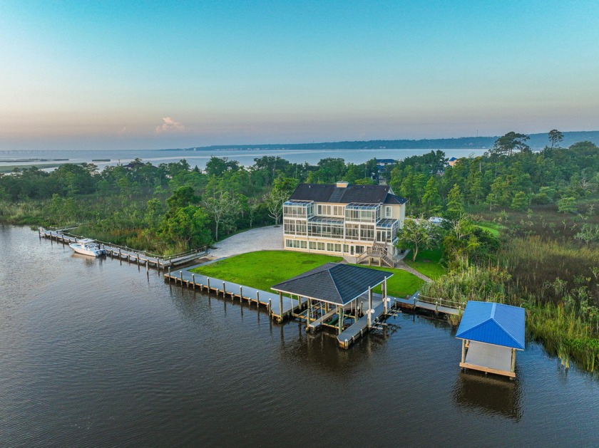 This WATERFRONT Home is a BOATER'S PARADISE! This custom-built - Beach Home for sale in Pensacola, Florida on Beachhouse.com