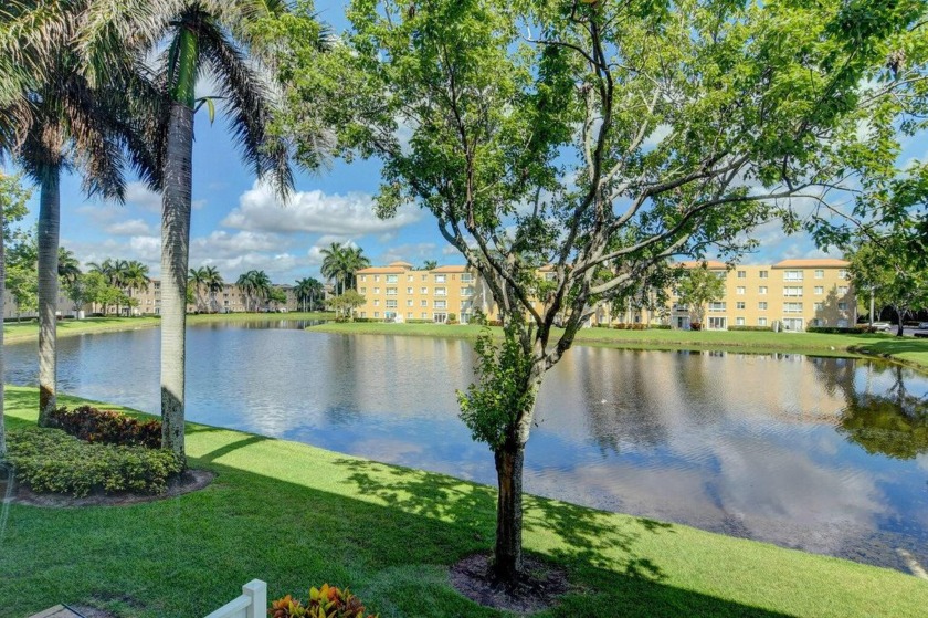 Enjoy breathtaking lake views from this charming 3-bedroom - Beach Condo for sale in Boynton Beach, Florida on Beachhouse.com