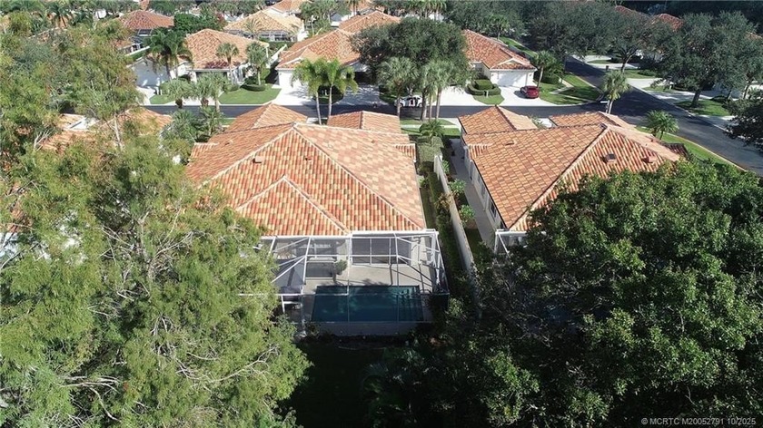 Prime Palm City lakeside villa with a pool offering privacy with - Beach Home for sale in Palm City, Florida on Beachhouse.com