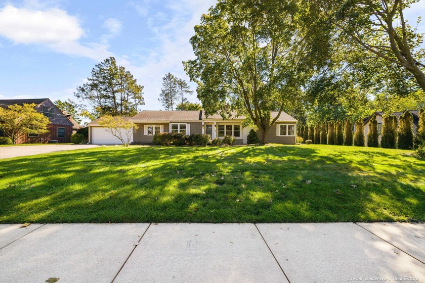 Welcome to 244 Grand Avenue! This west-side ranch on a double - Beach Home for sale in Grand Haven, Michigan on Beachhouse.com