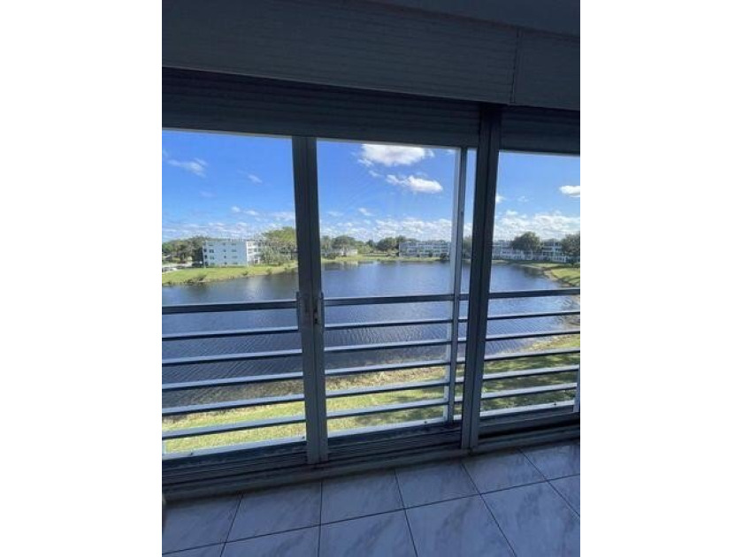 BEAUTIFUL ,FURNISHED, 2/1.5, PENTHOUSE CONDO with GORGEOUS LAKE - Beach Condo for sale in Deerfield Beach, Florida on Beachhouse.com