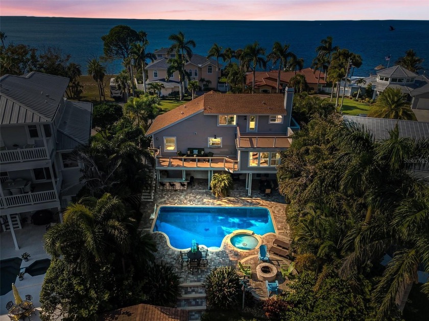 Welcome to 110 Carlyle Circle, in a lush tropical waterfront - Beach Home for sale in Palm Harbor, Florida on Beachhouse.com