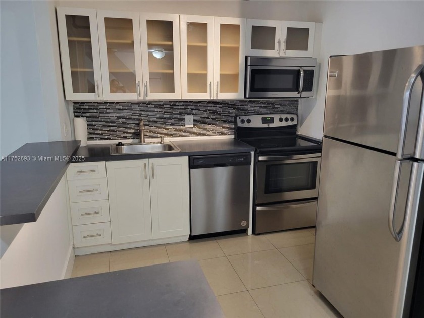 GORGEOUS,COZY,SPACIOUS UNIT EXQUISITELY UPDATED. NEW WOOD - Beach Condo for sale in North Miami, Florida on Beachhouse.com