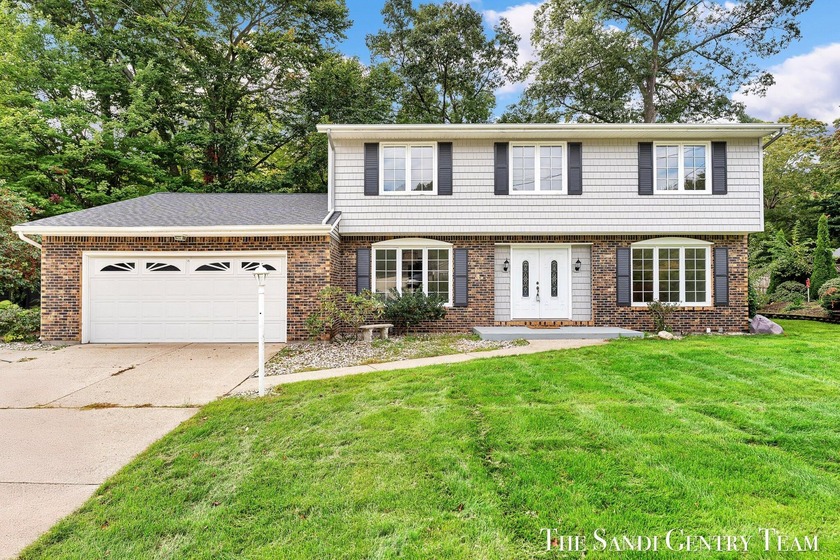 Welcome to 16230 Woodcrest Drive, a beautifully maintained - Beach Home for sale in Spring Lake, Michigan on Beachhouse.com