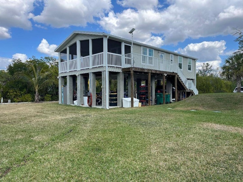 This 2023 stilt home sits on an oversized lot, offering over 250 - Beach Home for sale in Everglades City, Florida on Beachhouse.com