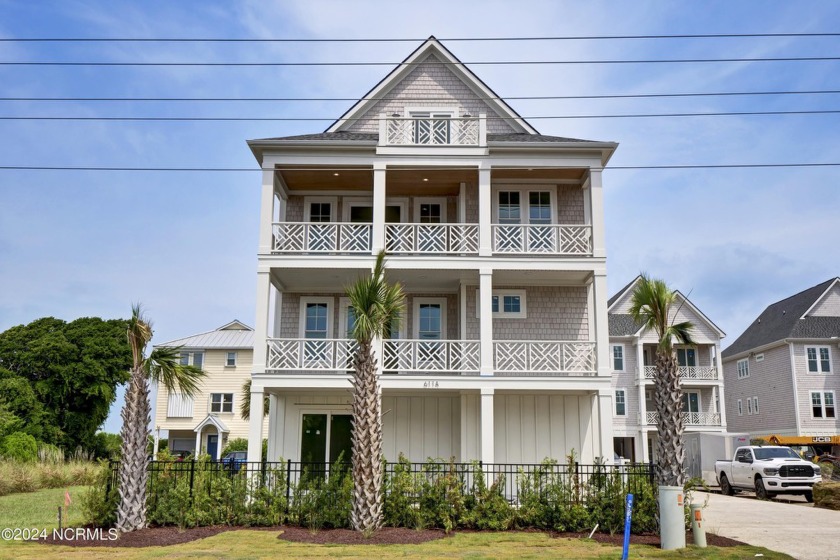 Discover unparalleled coastal living at 611a S Topsail Drive - Beach Home for sale in Surf City, North Carolina on Beachhouse.com