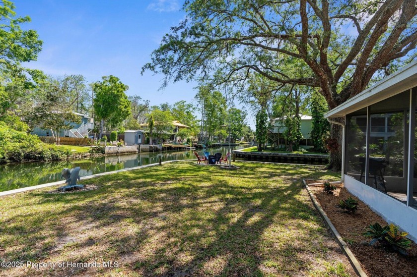 Tropical riverfront paradise in the Weeki Wachee Gardens! This - Beach Home for sale in Weeki Wachee, Florida on Beachhouse.com