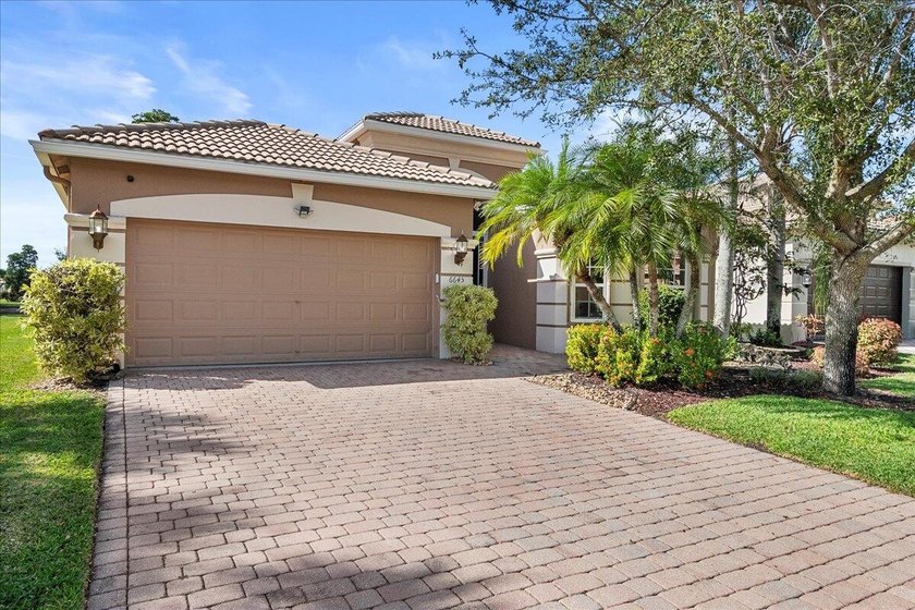 Welcome to an exceptional one-story single-family home nestled - Beach Home for sale in Lake Worth, Florida on Beachhouse.com