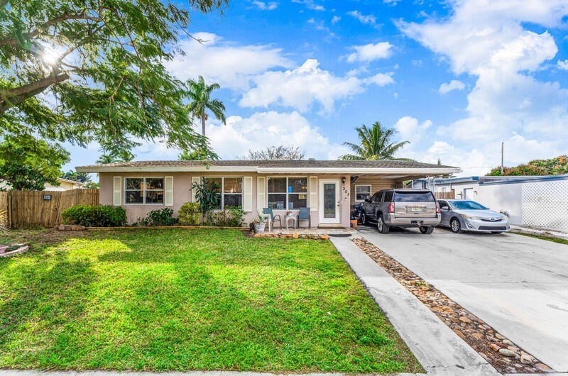 Come see this incredible 4-bedroom, 2-bath home located in the - Beach Home for sale in Palm Springs, Florida on Beachhouse.com