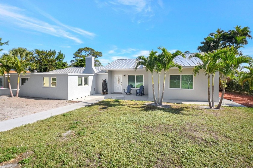 Unveil your own private lakeside retreat on the coveted shores - Beach Home for sale in Lake Worth, Florida on Beachhouse.com