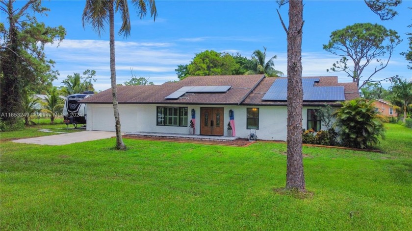 Take advantage of this beautiful 3/2 self-sufficient home on 1 - Beach Home for sale in West Palm Beach, Florida on Beachhouse.com