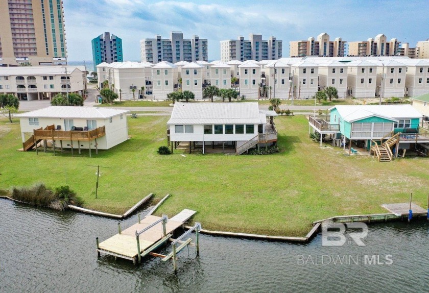 This 4-bedroom, 2.5-bathroom home is a prime waterfront location - Beach Home for sale in Gulf Shores, Alabama on Beachhouse.com