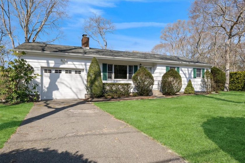 This Tiana Shores home includes an open floor plan living/dining - Beach Home for sale in Hampton Bays, New York on Beachhouse.com