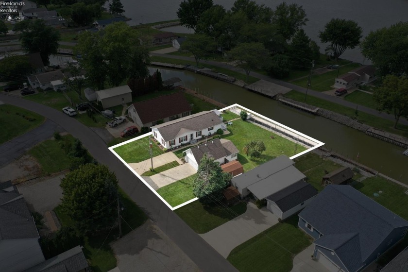 Discover this rare opportunity to own a spacious waterfront - Beach Home for sale in Port Clinton, Ohio on Beachhouse.com