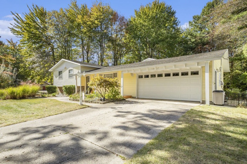 Welcome to this beautiful tri-level home, perfectly situated on - Beach Home for sale in Spring Lake, Michigan on Beachhouse.com