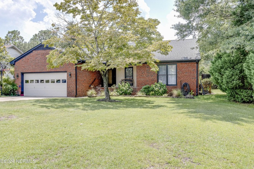 This charming brick ranch home is nestled along the serene canal - Beach Home for sale in New Bern, North Carolina on Beachhouse.com