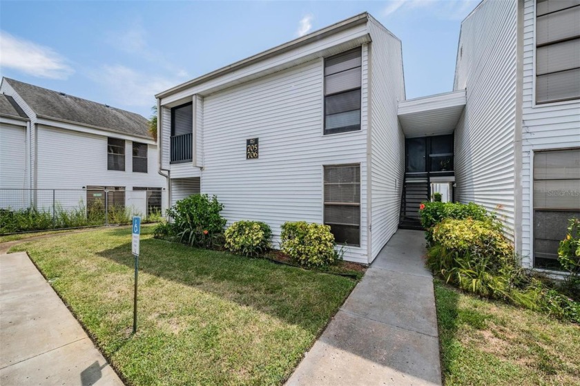 Discover this charming GROUND FLOOR corner unit condo in the - Beach Condo for sale in Tarpon Springs, Florida on Beachhouse.com