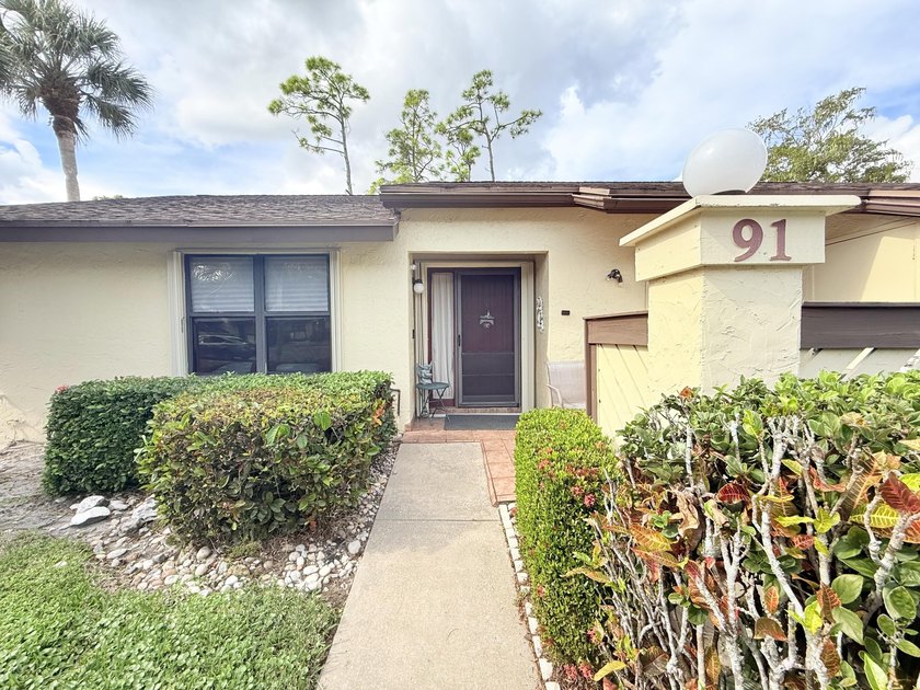 This well-maintained corner home in the 55+ community of - Beach Home for sale in Royal Palm Beach, Florida on Beachhouse.com