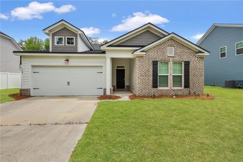 This charming 3-bedroom, 2-bath ranch-style home offers an - Beach Home for sale in Brunswick, Georgia on Beachhouse.com