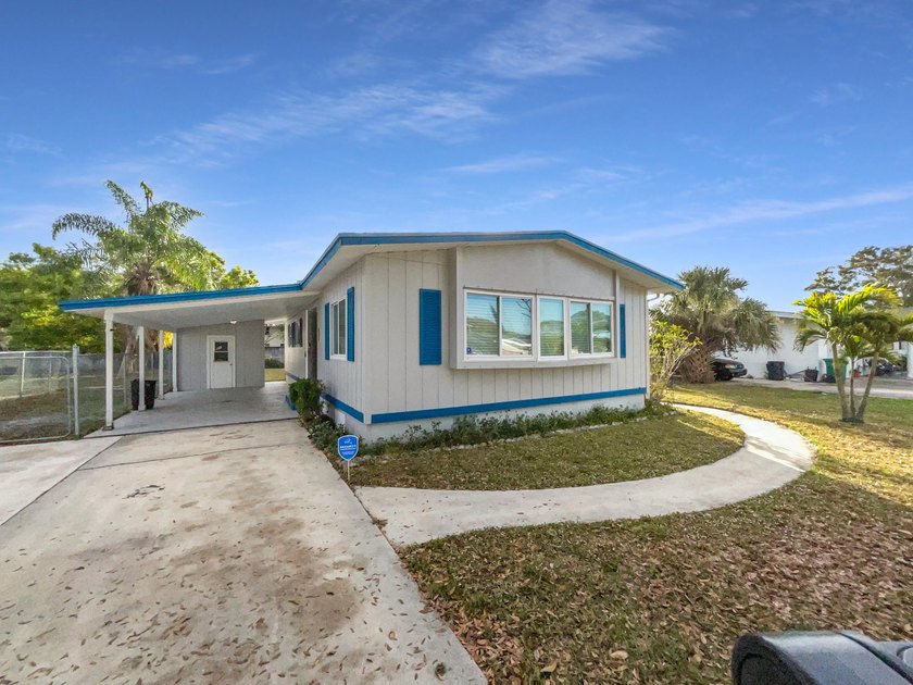 Welcome to 409 Coconut Ave E, a home that exudes charm and - Beach Home for sale in Port Saint Lucie, Florida on Beachhouse.com