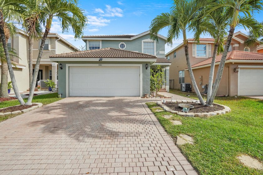 Spacious 3-bedroom, 2.5-bath lakefront home in desired gated - Beach Home for sale in Greenacres, Florida on Beachhouse.com