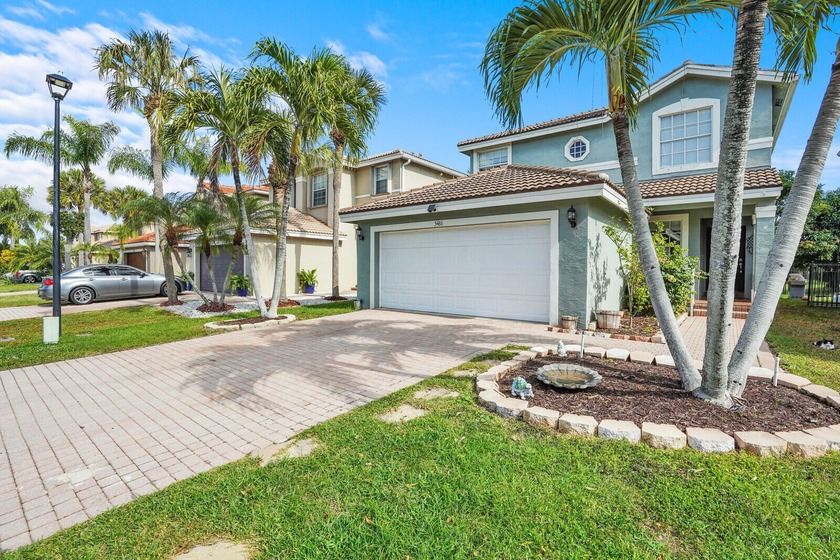 Spacious 3-bedroom, 2.5-bath lakefront home in desired gated - Beach Home for sale in Greenacres, Florida on Beachhouse.com