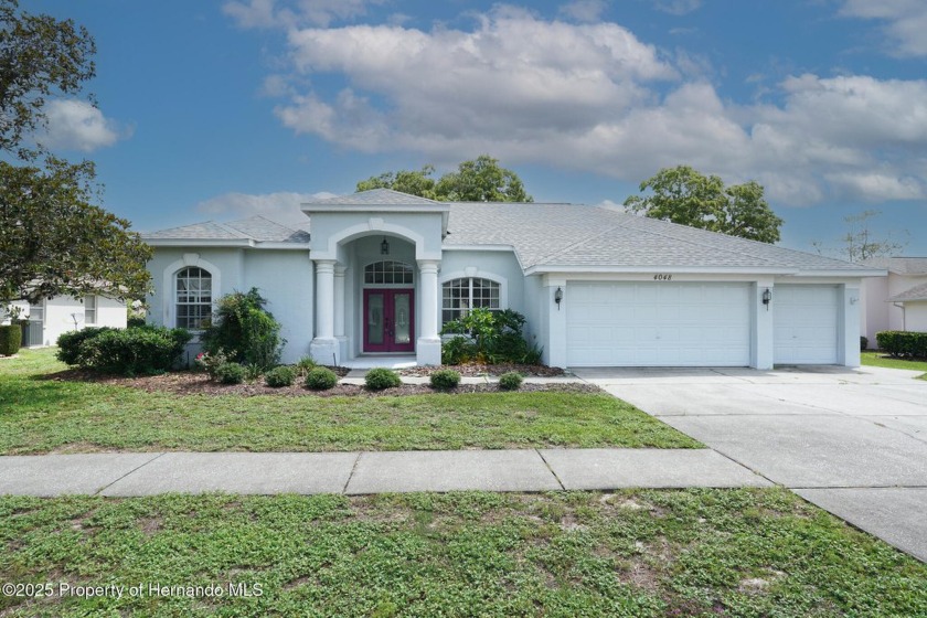 Luxurious pool home in Pristine Place! Walk through the front - Beach Home for sale in Spring Hill, Florida on Beachhouse.com