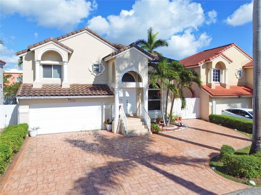 Stunning 4-bedroom, 3-bathroom residence featuring a convenient - Beach Home for sale in Miami, Florida on Beachhouse.com