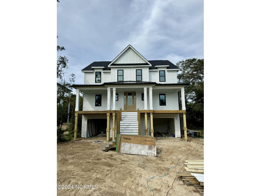 Discover coastal luxury in the quiet Deer Horn Dunes - Beach Home for sale in Emerald Isle, North Carolina on Beachhouse.com