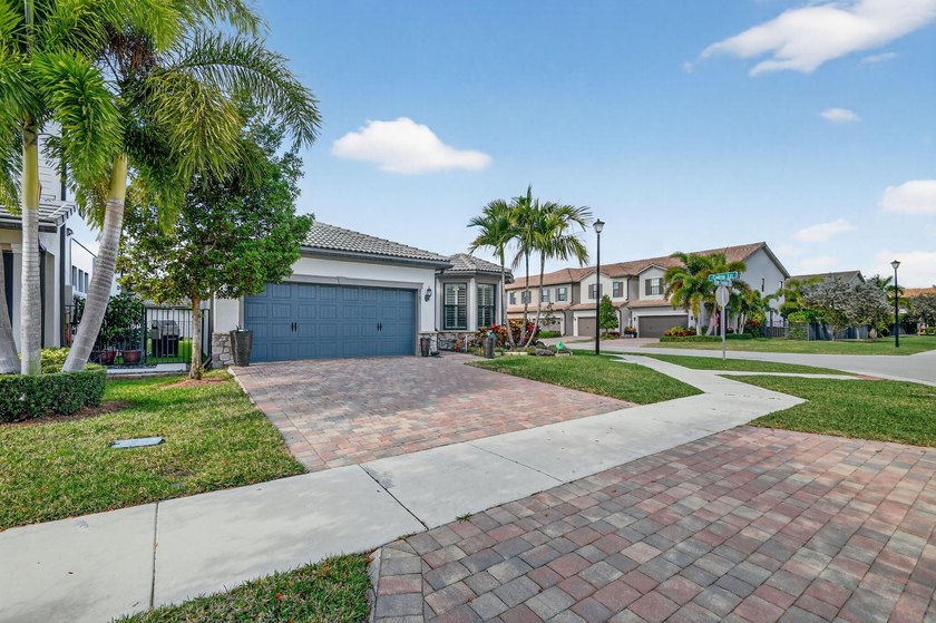 A refined single-family residence set on a quiet street within a - Beach Home for sale in Lake Worth, Florida on Beachhouse.com