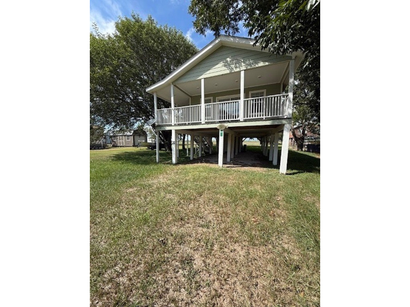 Nestled beneath a canopy of mature oak, ash, and pecan trees - Beach Home for sale in Palacios, Texas on Beachhouse.com