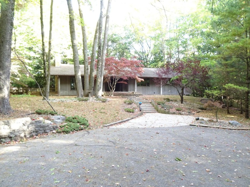 This Beautiful Ranch home is located on 9.75 acres M/L of - Beach Home for sale in Manistee, Michigan on Beachhouse.com