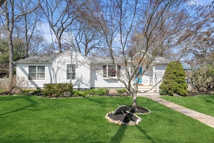Enjoy a short stroll to the water from this inviting and sunny - Beach Home for sale in East Patchogue, New York on Beachhouse.com