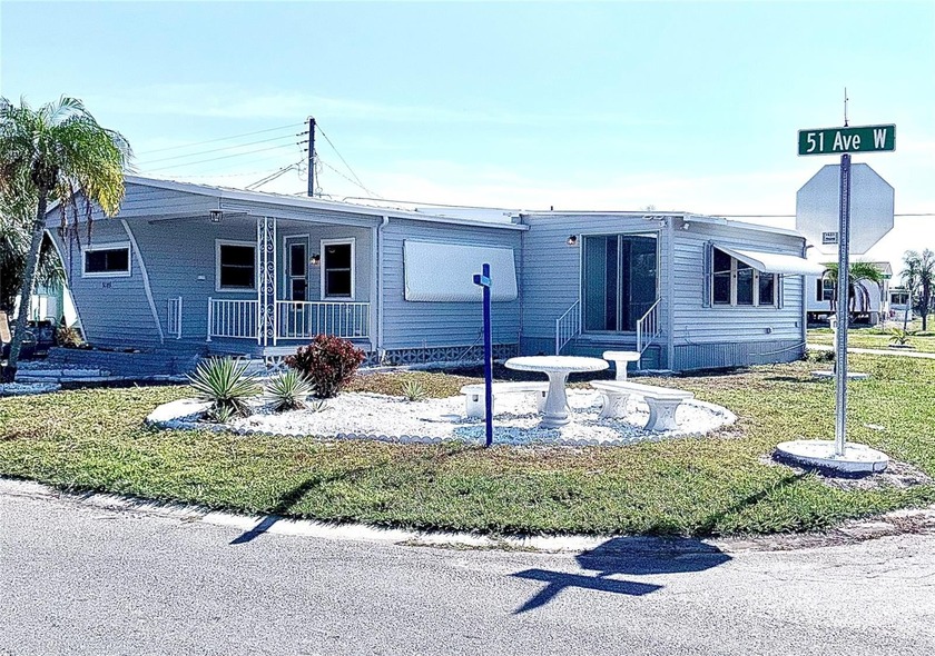Welcome to this beautifully updated corner-lot home tucked - Beach Home for sale in Bradenton, Florida on Beachhouse.com