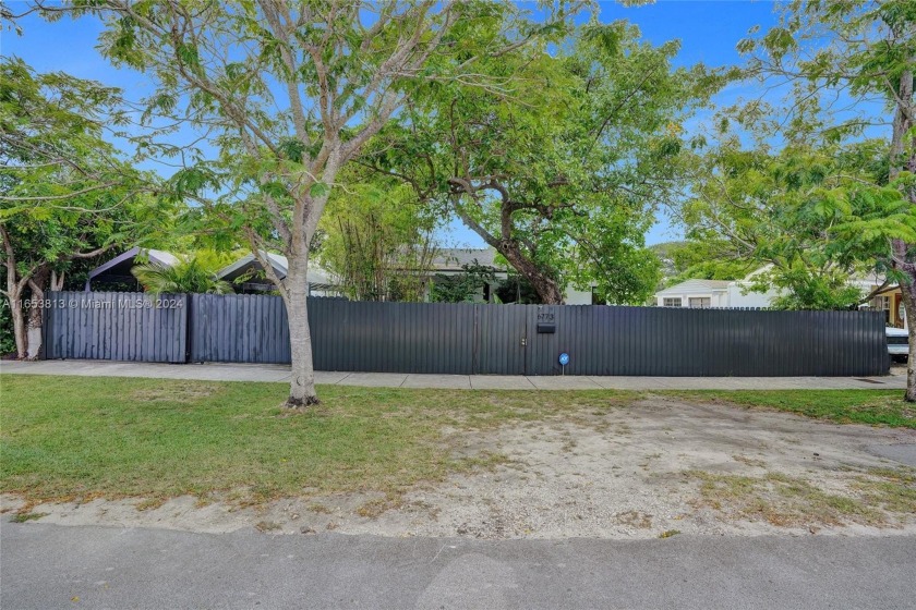 Nestled behind the gate & amongst the foliage, enjoy your own - Beach Home for sale in Miami, Florida on Beachhouse.com