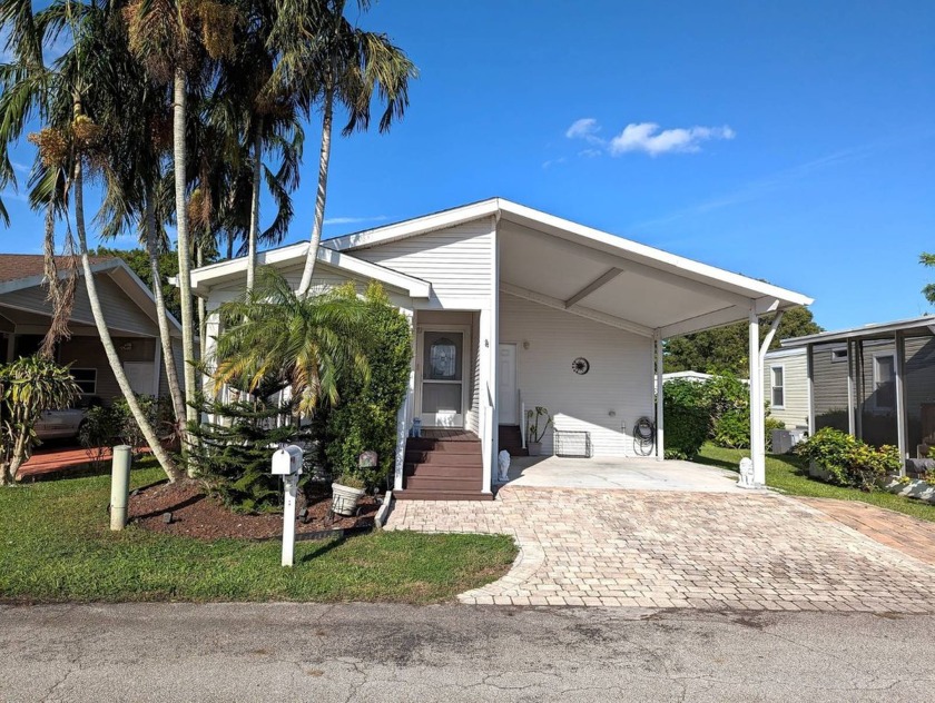 This delightful Palm Harbor 2-bedroom, 2-bathroom home, with an - Beach Home for sale in Margate, Florida on Beachhouse.com